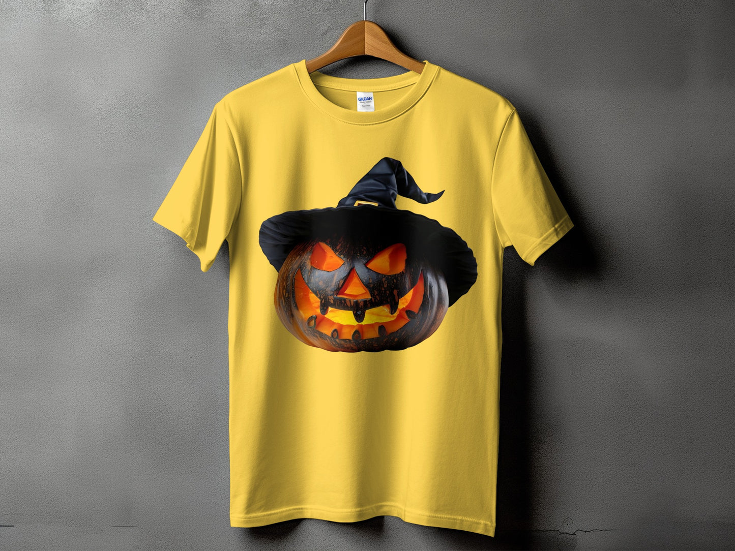 Yellow t-shirt with a carved Jack-o'-lantern wearing a witch hat.