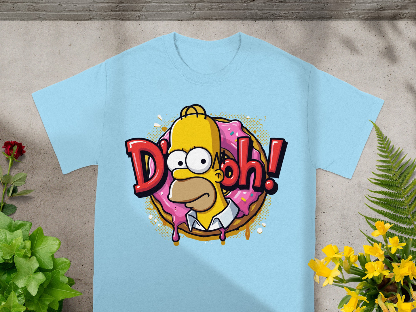 Light blue t-shirt with Homer Simpson saying "D'oh!" over a pink donut.