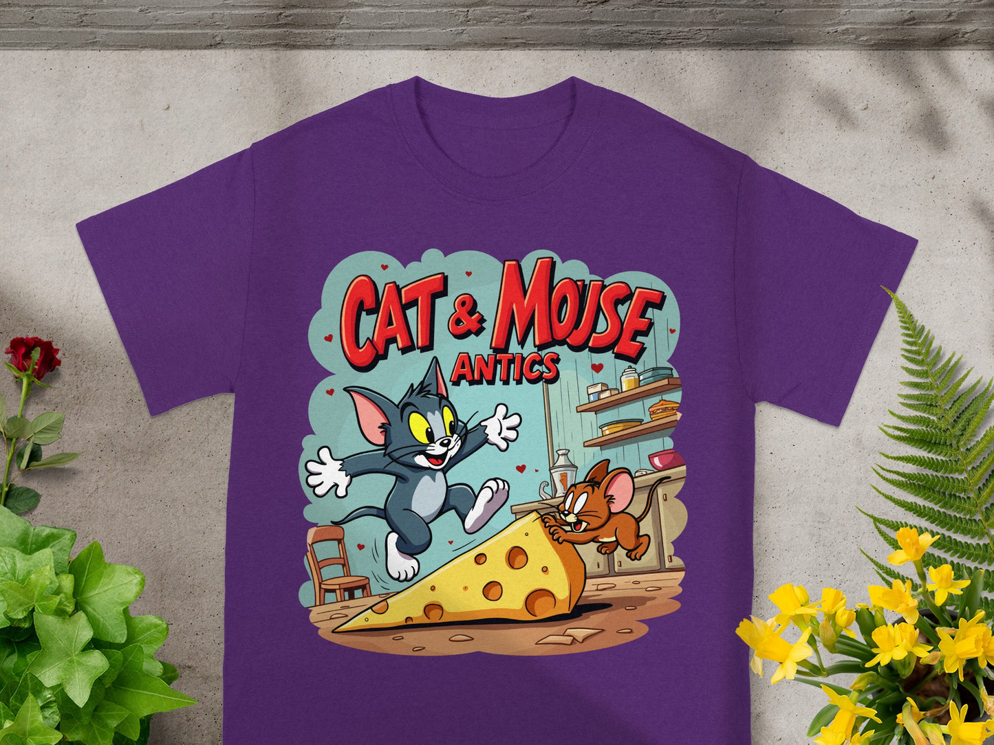 Purple t-shirt with Cat & Mouse Antics graphic featuring Tom and Jerry chasing cheese.