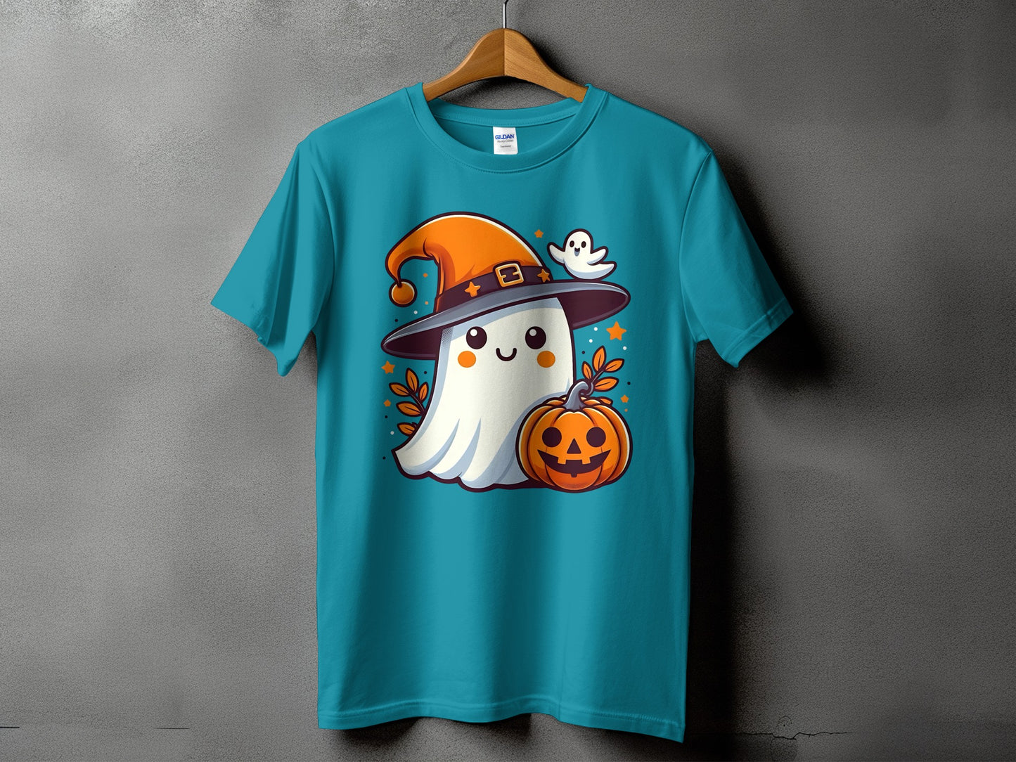 Teal t-shirt with cartoon ghost wearing a witch hat and holding a pumpkin.