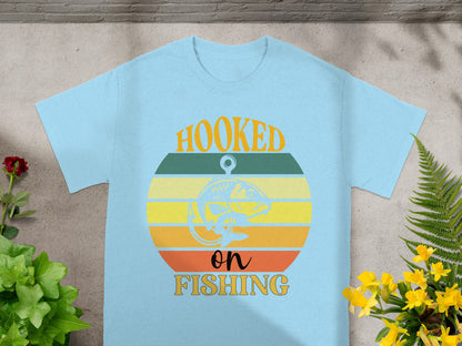 Light blue t-shirt with "Hooked on Fishing" graphic featuring a fish and retro stripes.