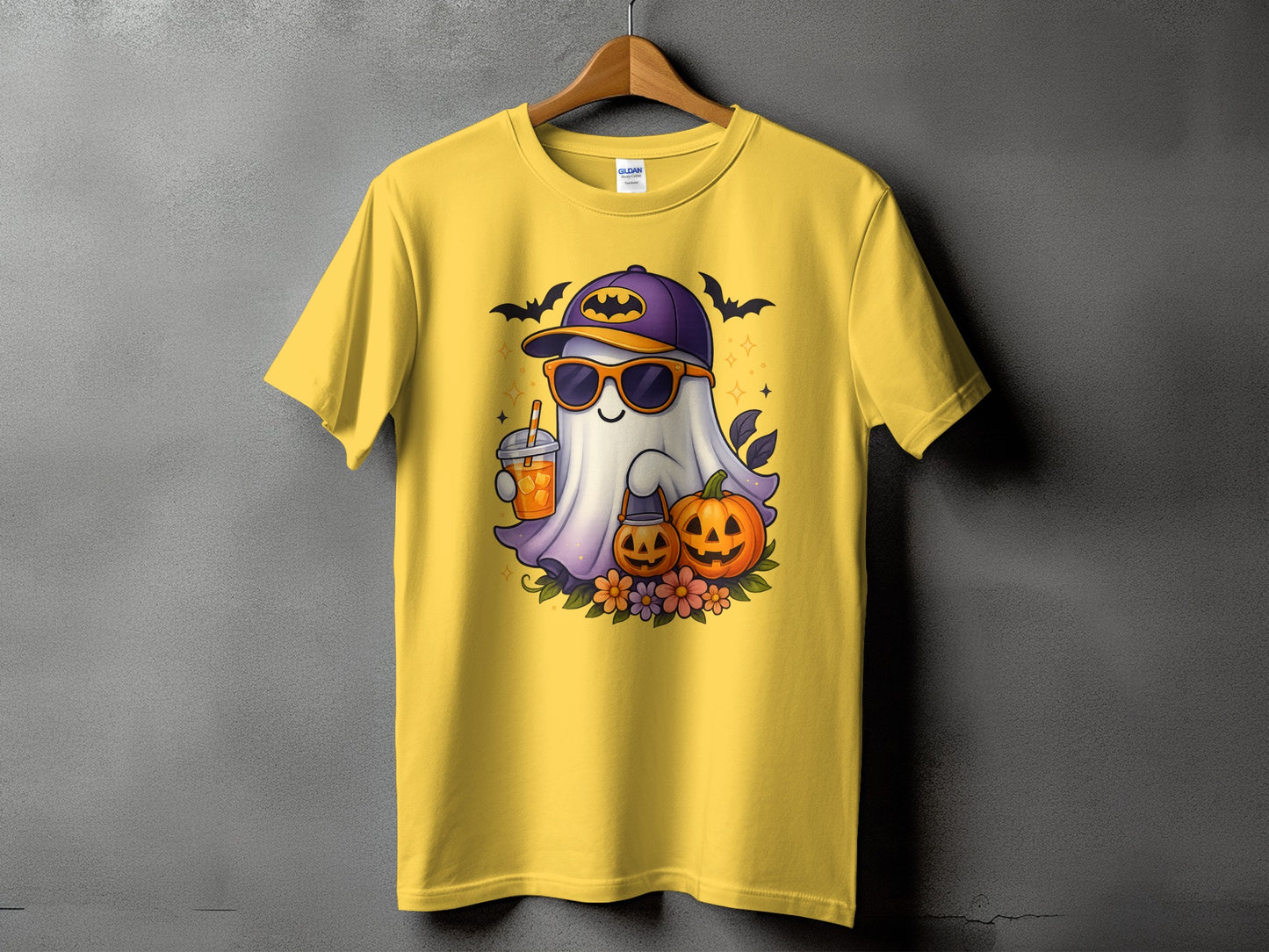 Yellow t-shirt with a cartoon ghost wearing sunglasses and a Batman hat.