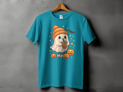 Teal t-shirt with a cartoon ghost in an orange hat holding bubble tea, surrounded by pumpkins.