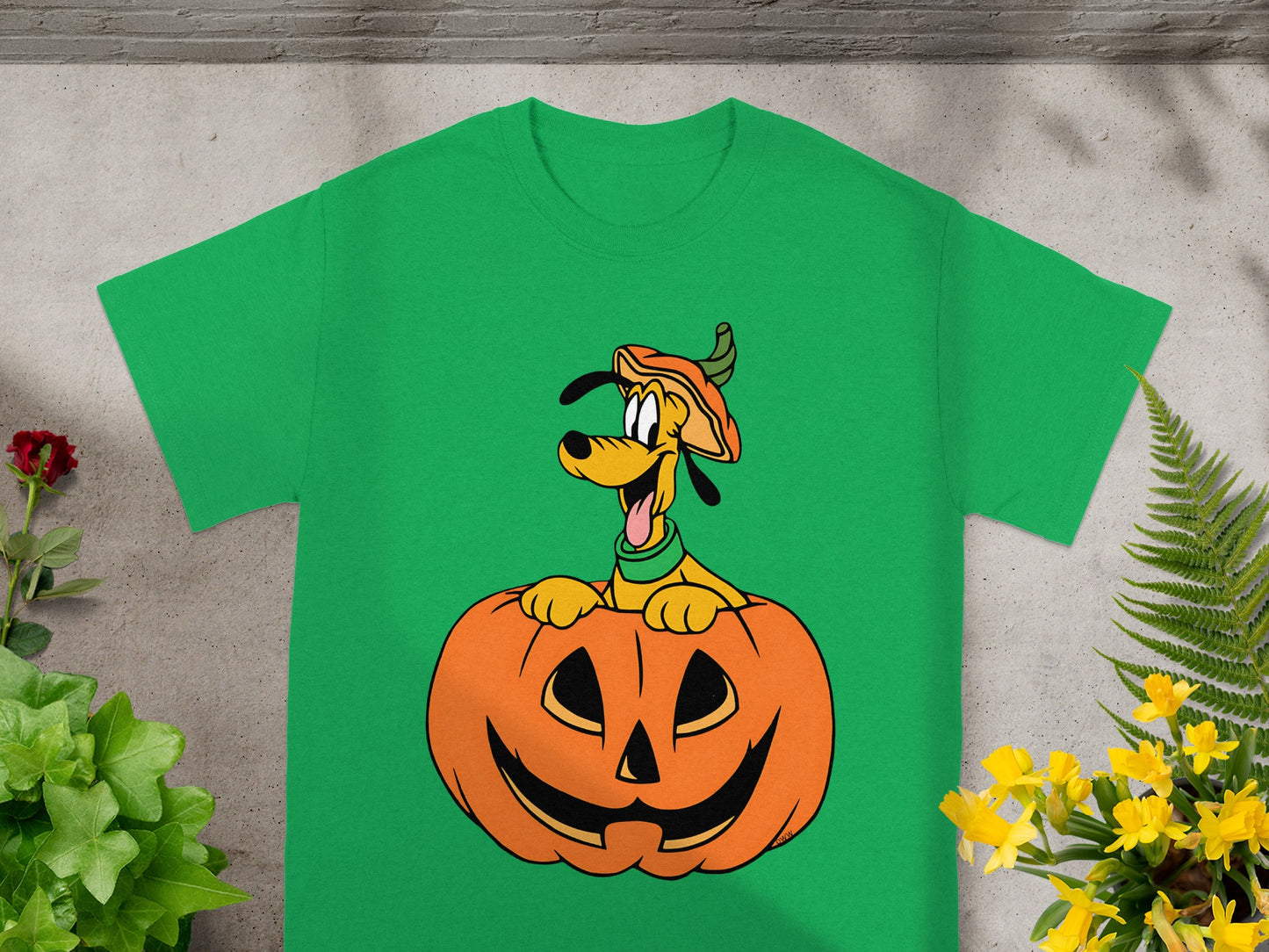 Green t-shirt with Pluto peeking out of a jack-o'-lantern.
