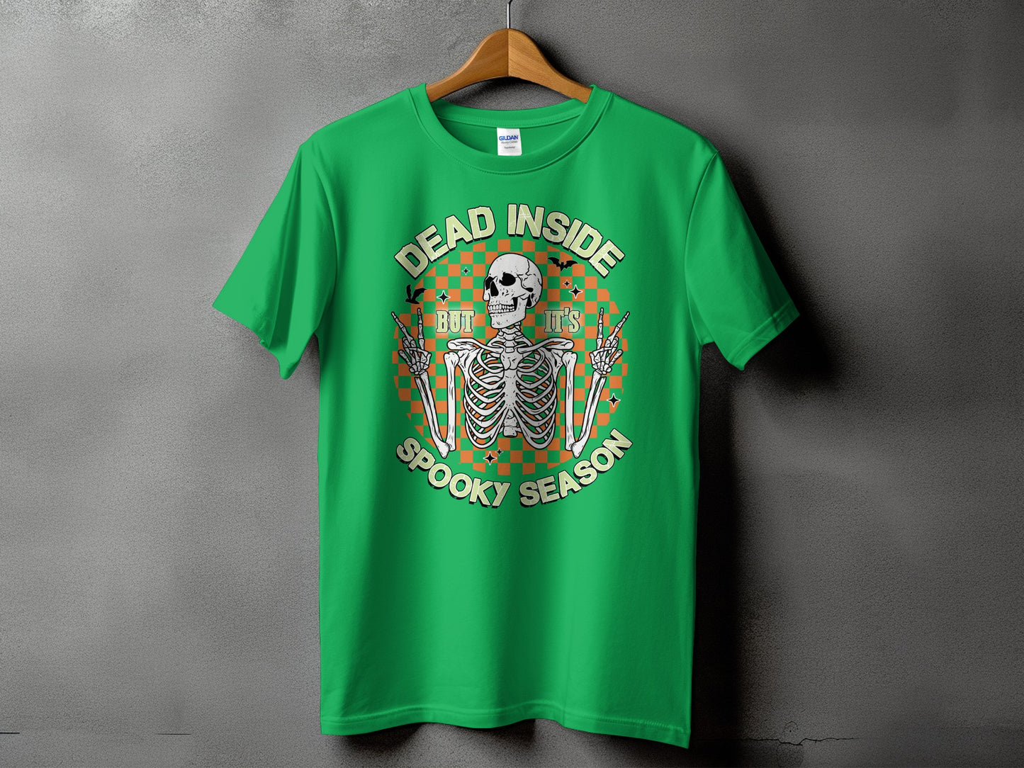 Green t-shirt with skeleton graphic and text "DEAD INSIDE BUT IT'S SPOOKY SEASON".