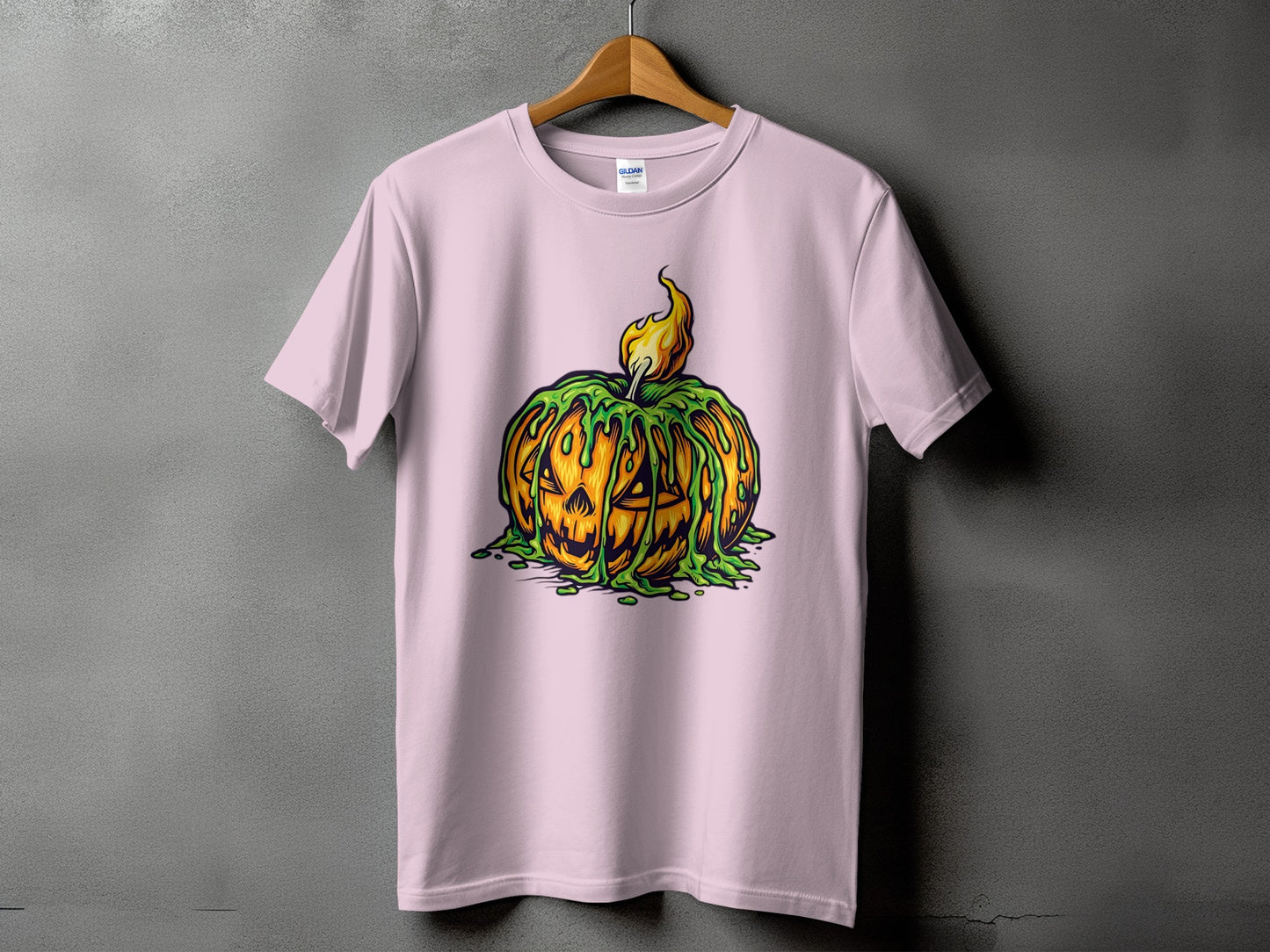 Pink t-shirt with a Jack-o'-lantern design with green slime and flames.