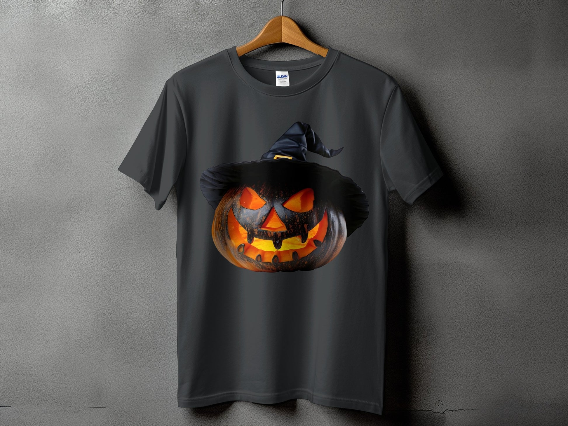 Dark gray t-shirt with a carved, glowing jack-o'-lantern wearing a witch hat.