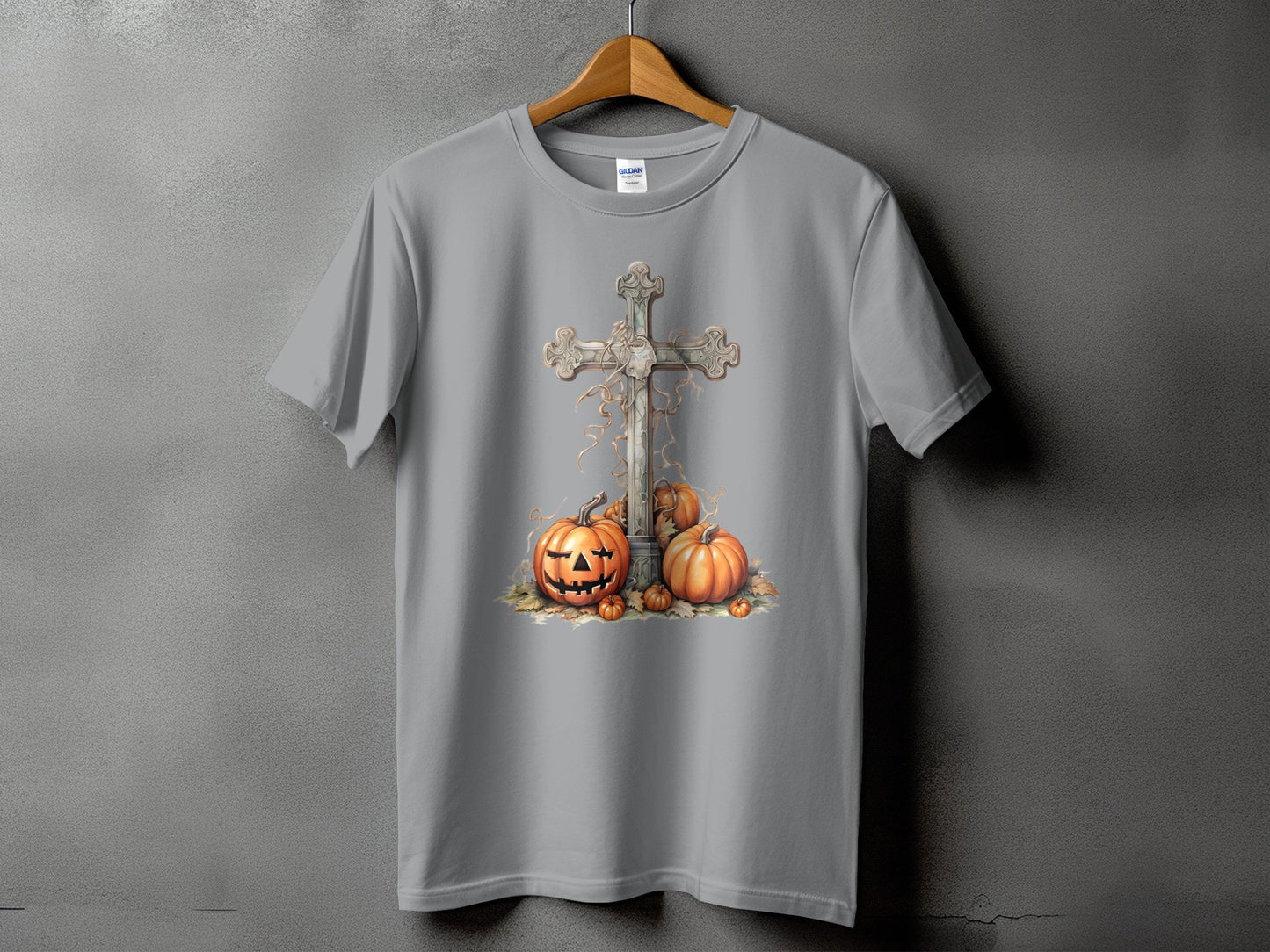 Gray t-shirt with a graphic of a cross, pumpkins, and fall leaves.