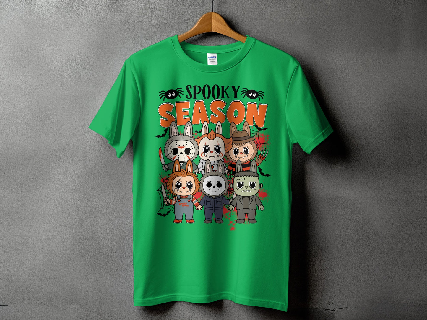 Green t-shirt with cartoon horror characters and "Spooky Season" text.