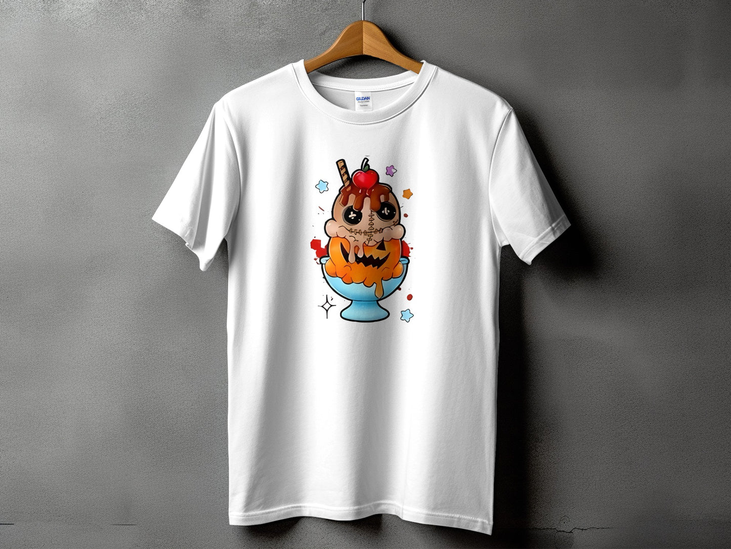 White t-shirt with cartoon ice cream sundae in a pumpkin bowl graphic.
