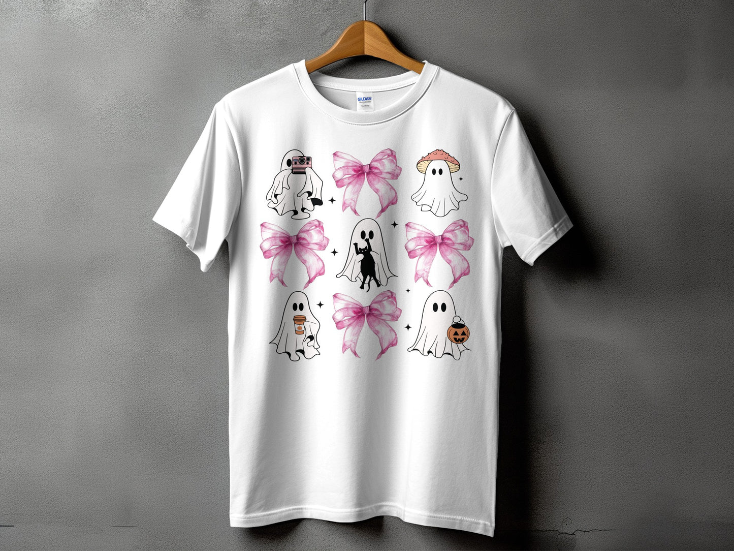 White t-shirt with a grid of cute ghost illustrations and pink bows.