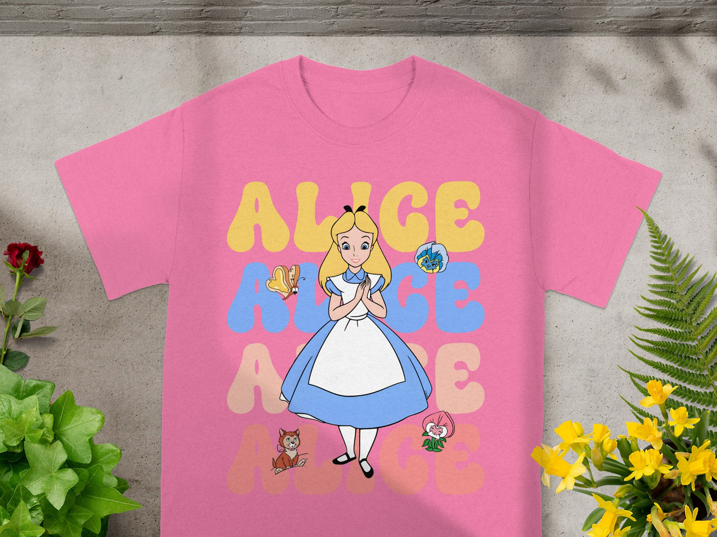 Pink t-shirt with Alice in Wonderland characters and "ALICE" text.