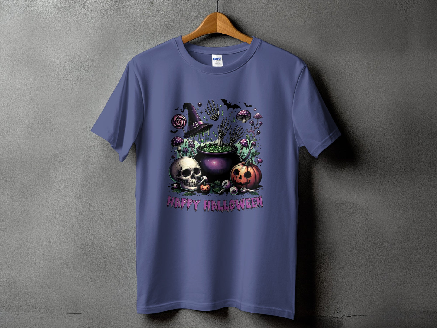 Purple t-shirt with Halloween graphic featuring a cauldron, skull, pumpkin, and skeleton hands.