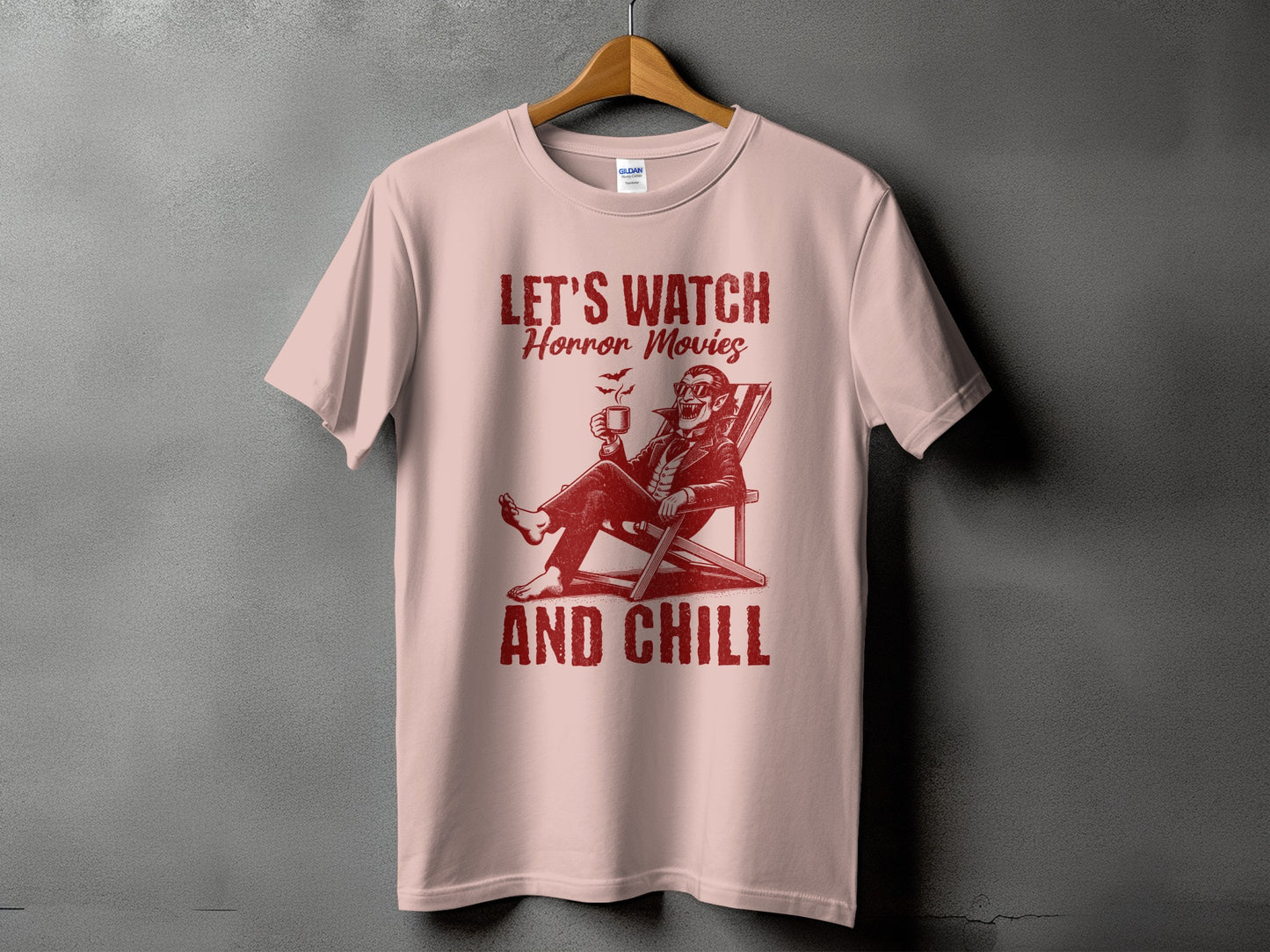 Pink t-shirt with "LET'S WATCH Horror Movies AND CHILL" text and vampire graphic.