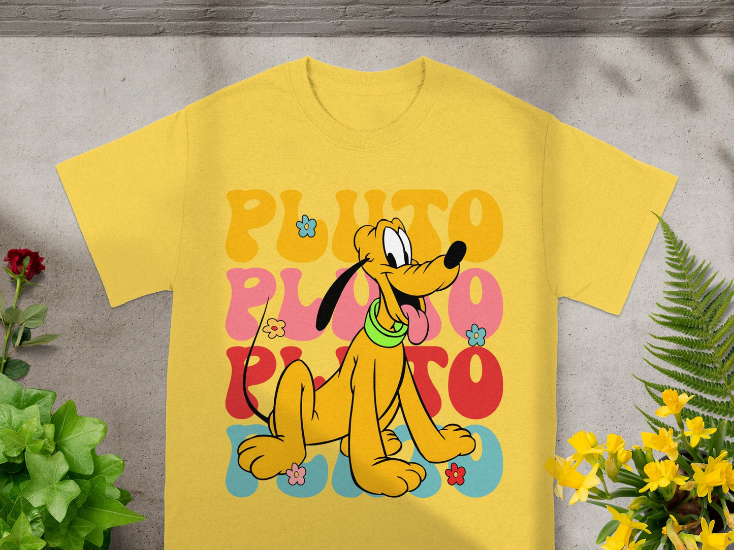 Yellow t-shirt with Pluto character and retro "Pluto" text.