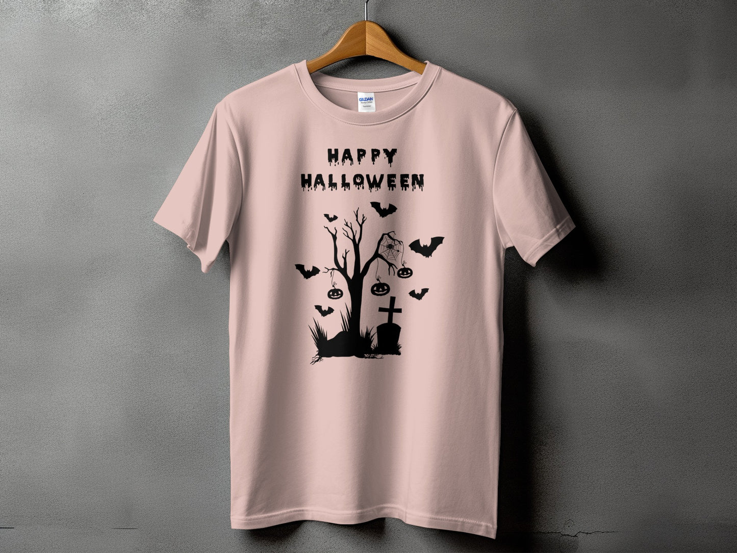 Pink t-shirt with black "Happy Halloween" text and spooky graveyard graphic.