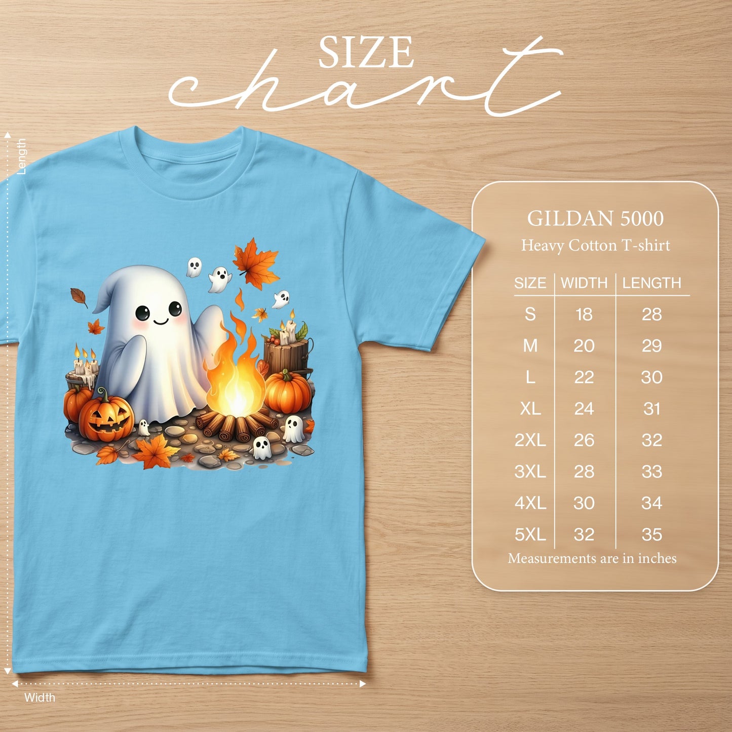 Light blue Gildan 5000 t-shirt with cartoon ghosts, pumpkins, campfire, and autumn leaves graphic.