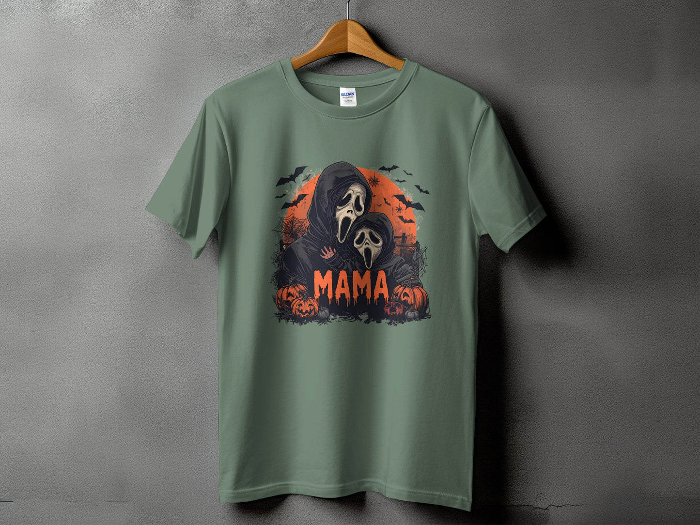 Ghostface mama and baby Halloween graphic on a green t-shirt.