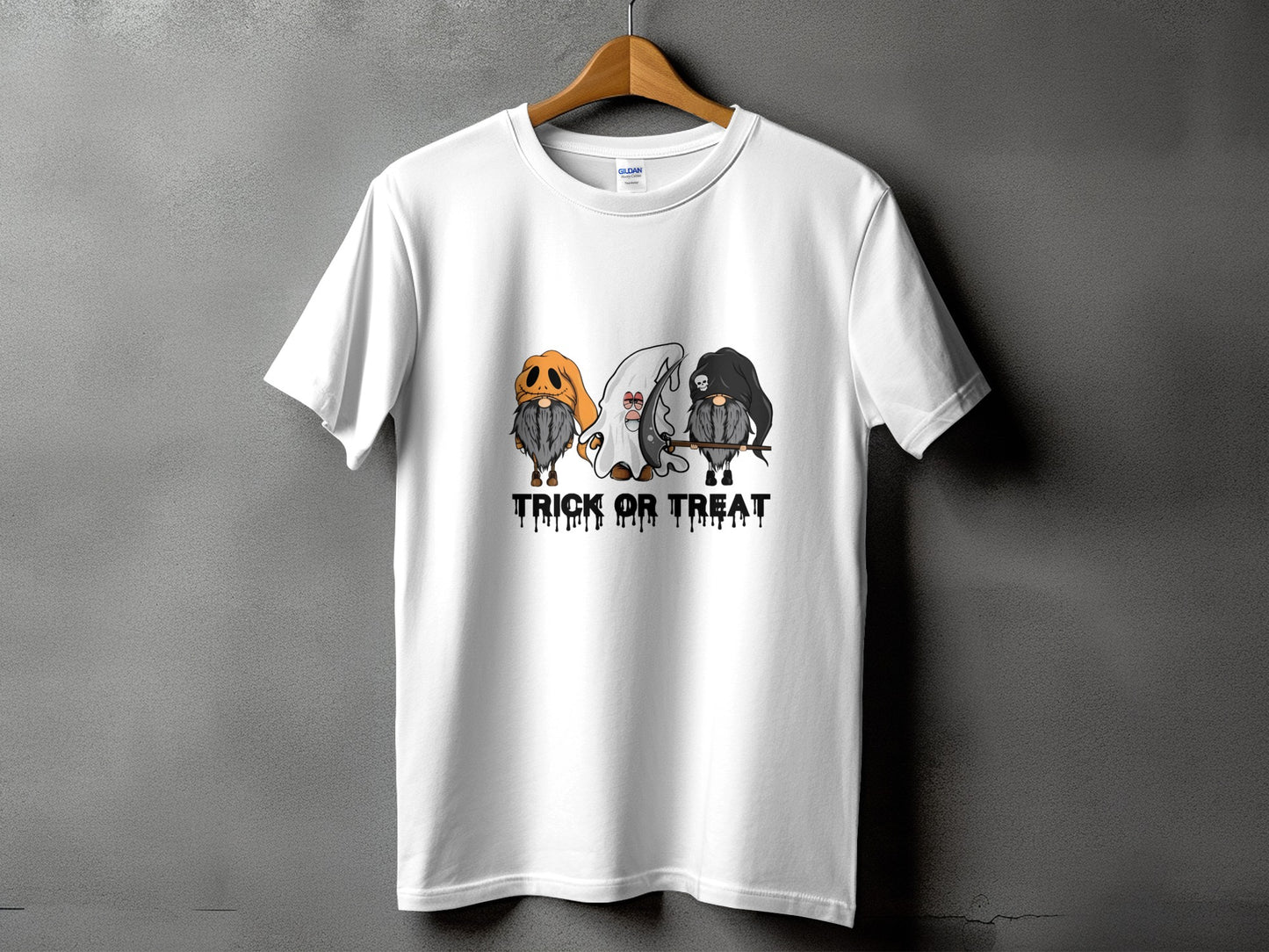 White t-shirt with three gnomes in Halloween costumes and the text "TRICK OR TREAT".