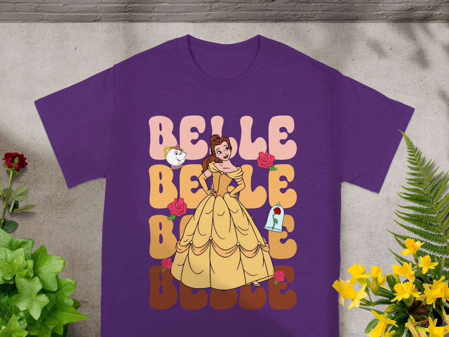 Purple t-shirt with Belle from Beauty and the Beast and floral accents.