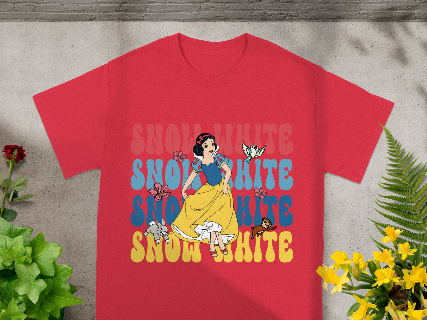 Red t-shirt with Snow White illustration and colorful "Snow White" text.