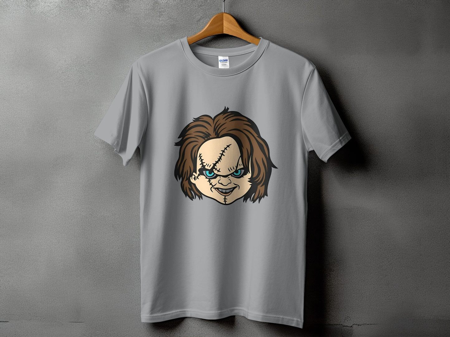 Grey t-shirt with Chucky doll face graphic on front.