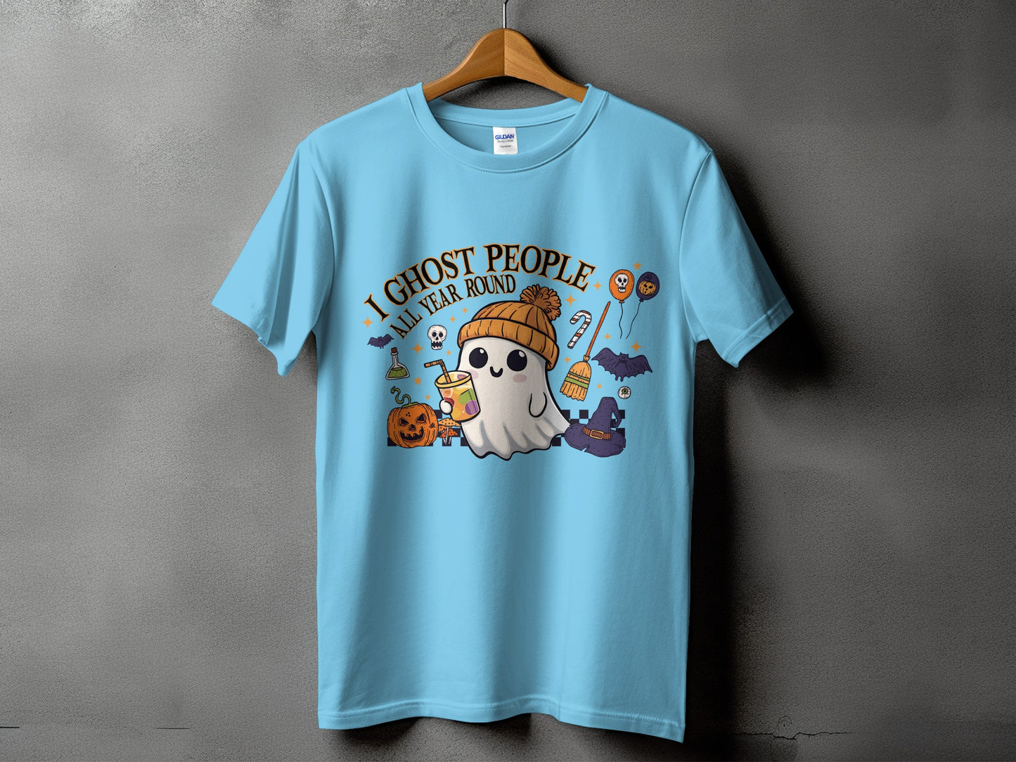 Light blue t-shirt with "I Ghost People All Year Round" text and Halloween graphics.
