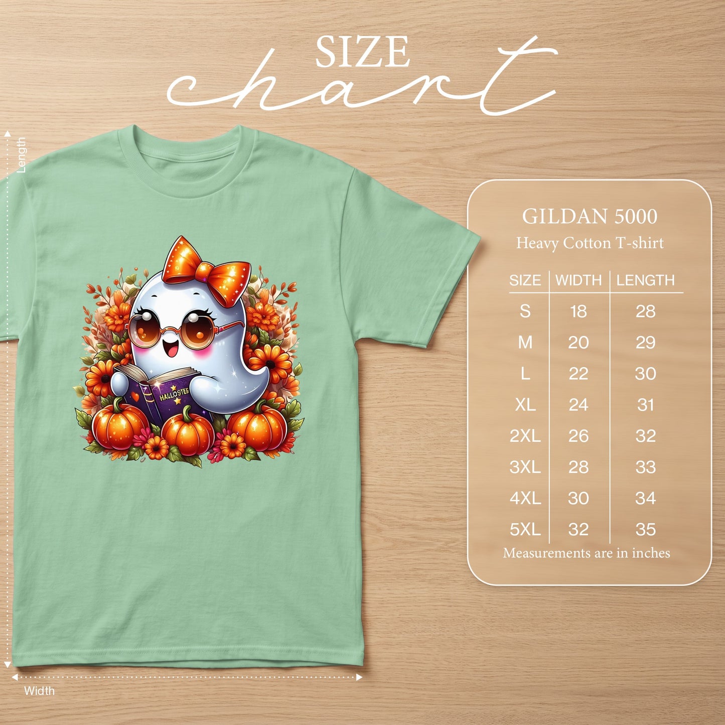 Light green t-shirt with cartoon ghost reading a book, pumpkins, and flowers, with size chart.