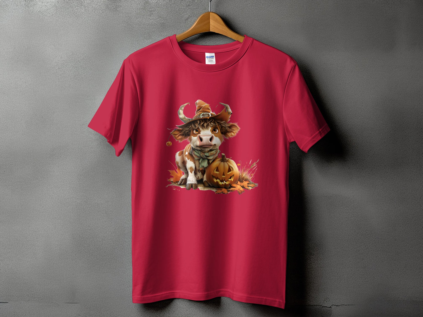 Red t-shirt with a cow in a witch hat and a jack-o'-lantern.