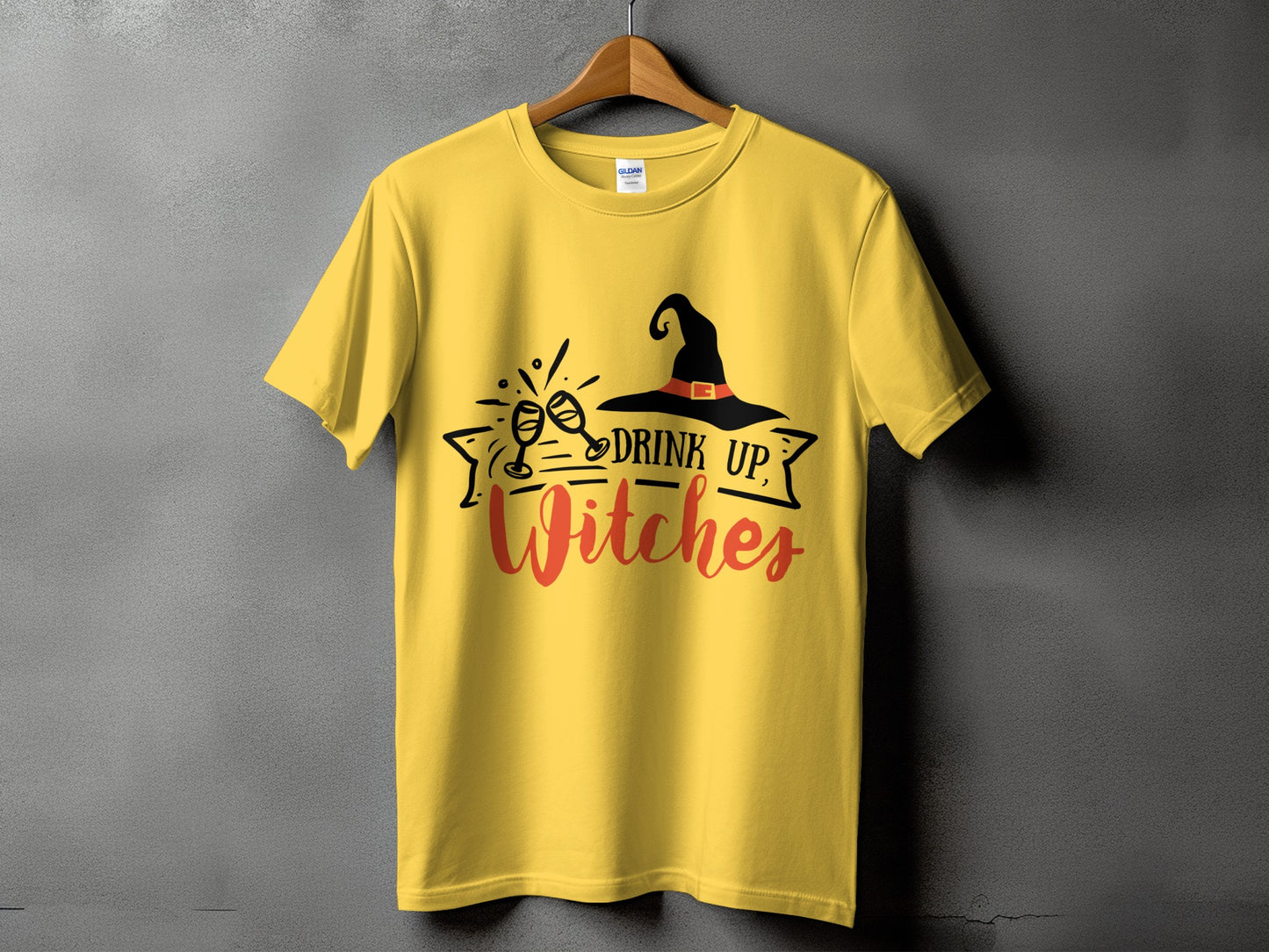 Yellow t-shirt with "Drink Up, Witches" text and witch hat graphic.