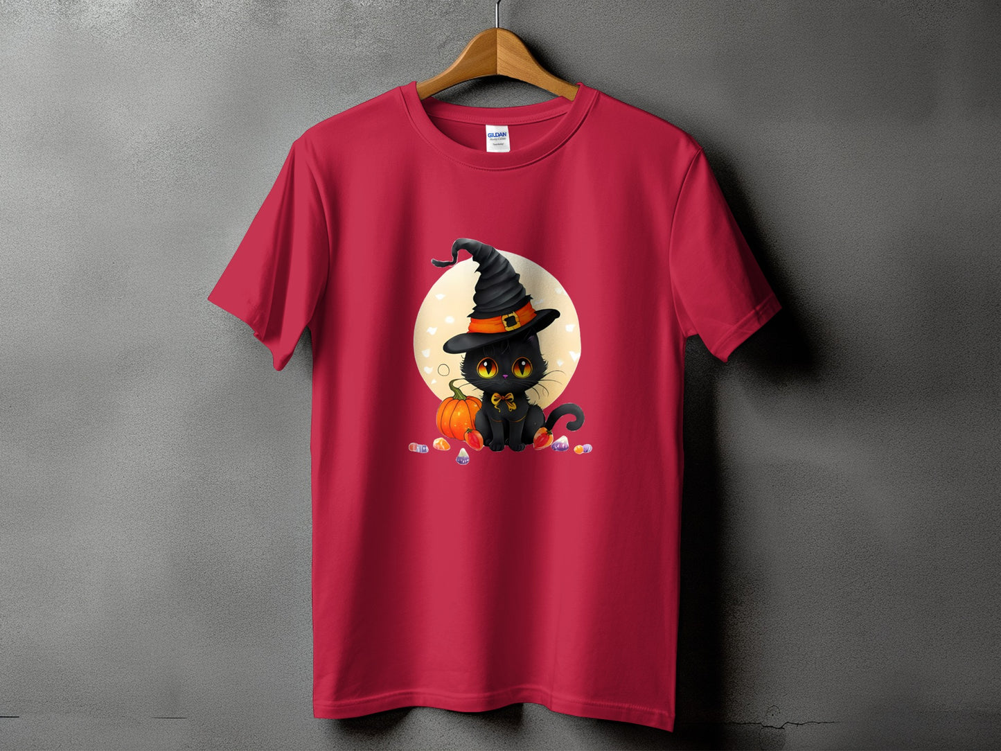 Red t-shirt with a black cat in a witch hat and candy corn.