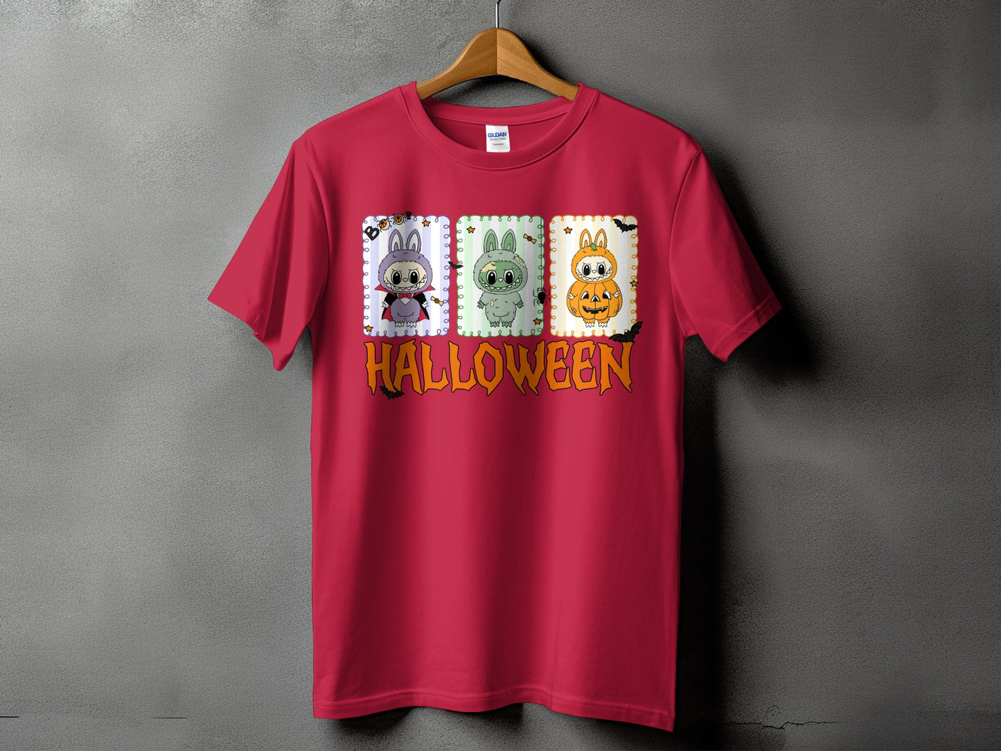 Red t-shirt with three Halloween-themed bunnies and the word "HALLOWEEN" in orange.