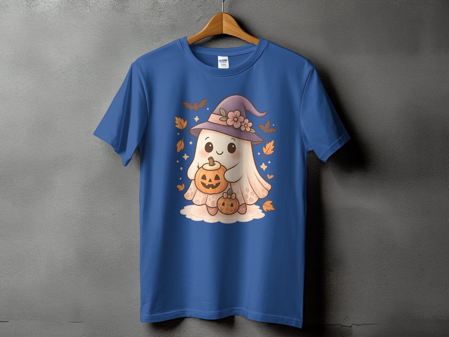 Blue t-shirt with a cute ghost wearing a witch hat holding pumpkins.