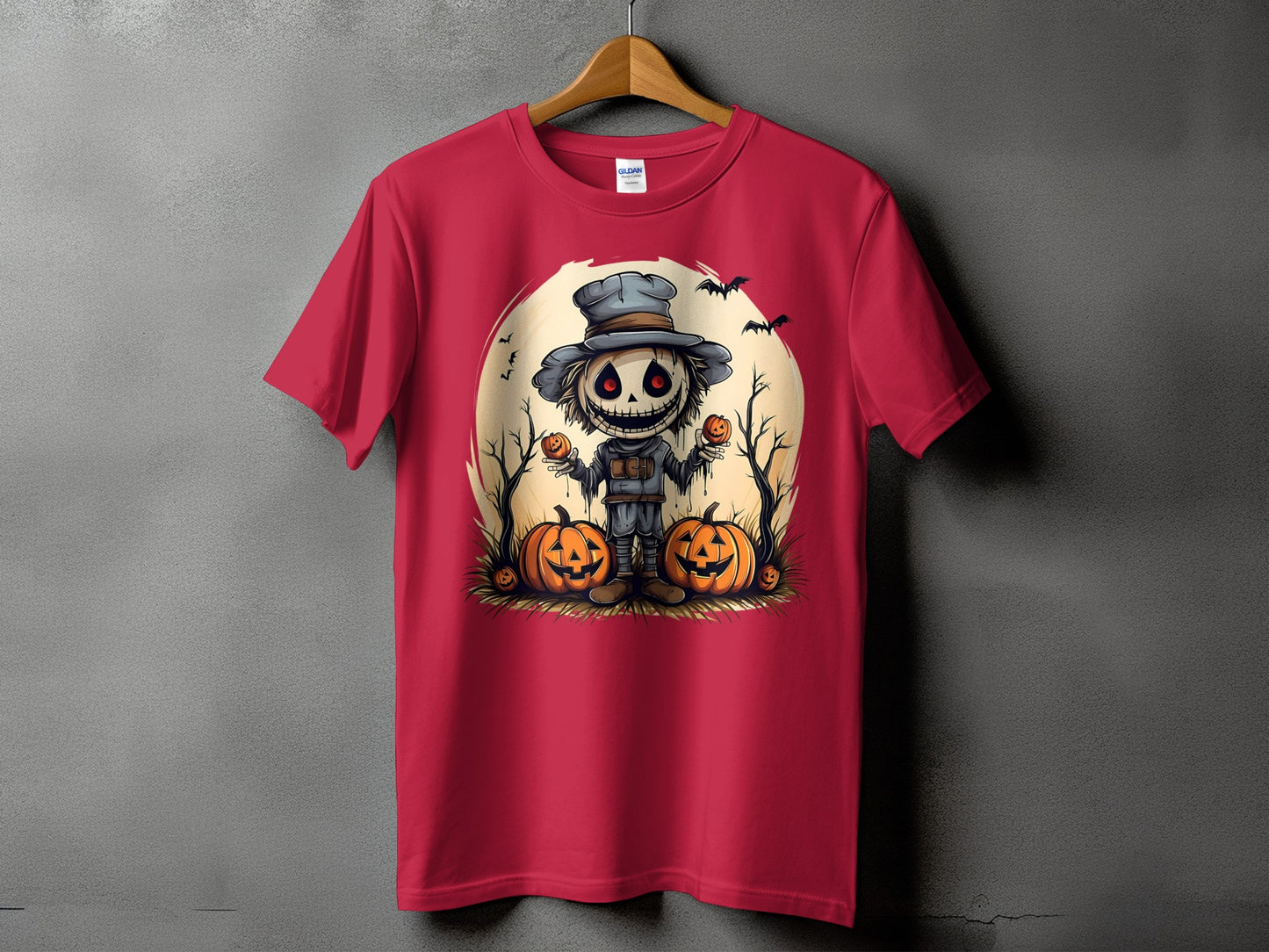 Red t-shirt featuring a spooky scarecrow with glowing red eyes and pumpkins.