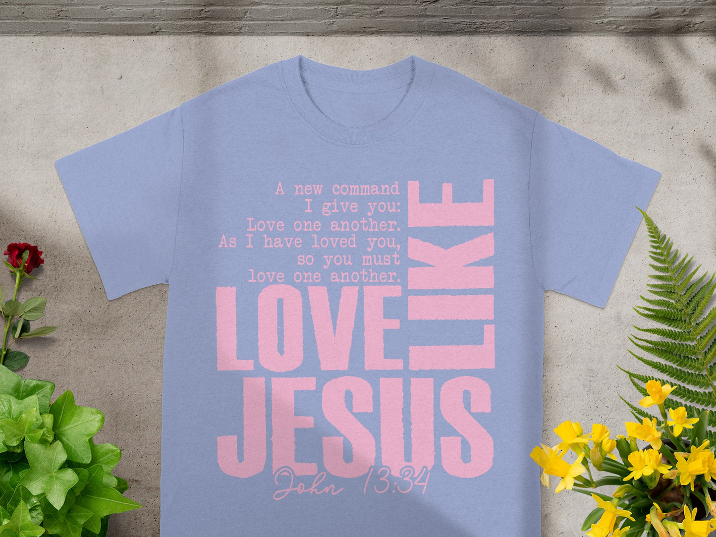 Light purple t-shirt with pink text: "Love Jesus" and Bible verse John 13:34.