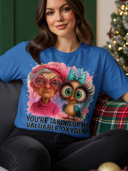 Cartoon owl and elderly woman graphic on a blue t-shirt.