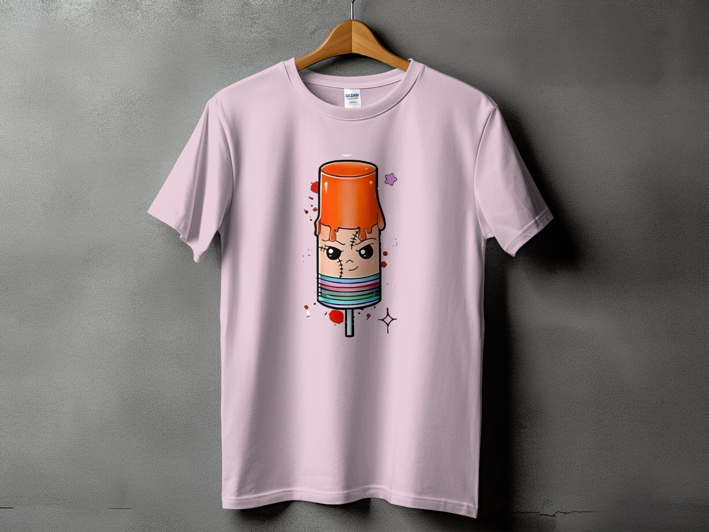Pink t-shirt with cartoon popsicle design, featuring stitches and drips.