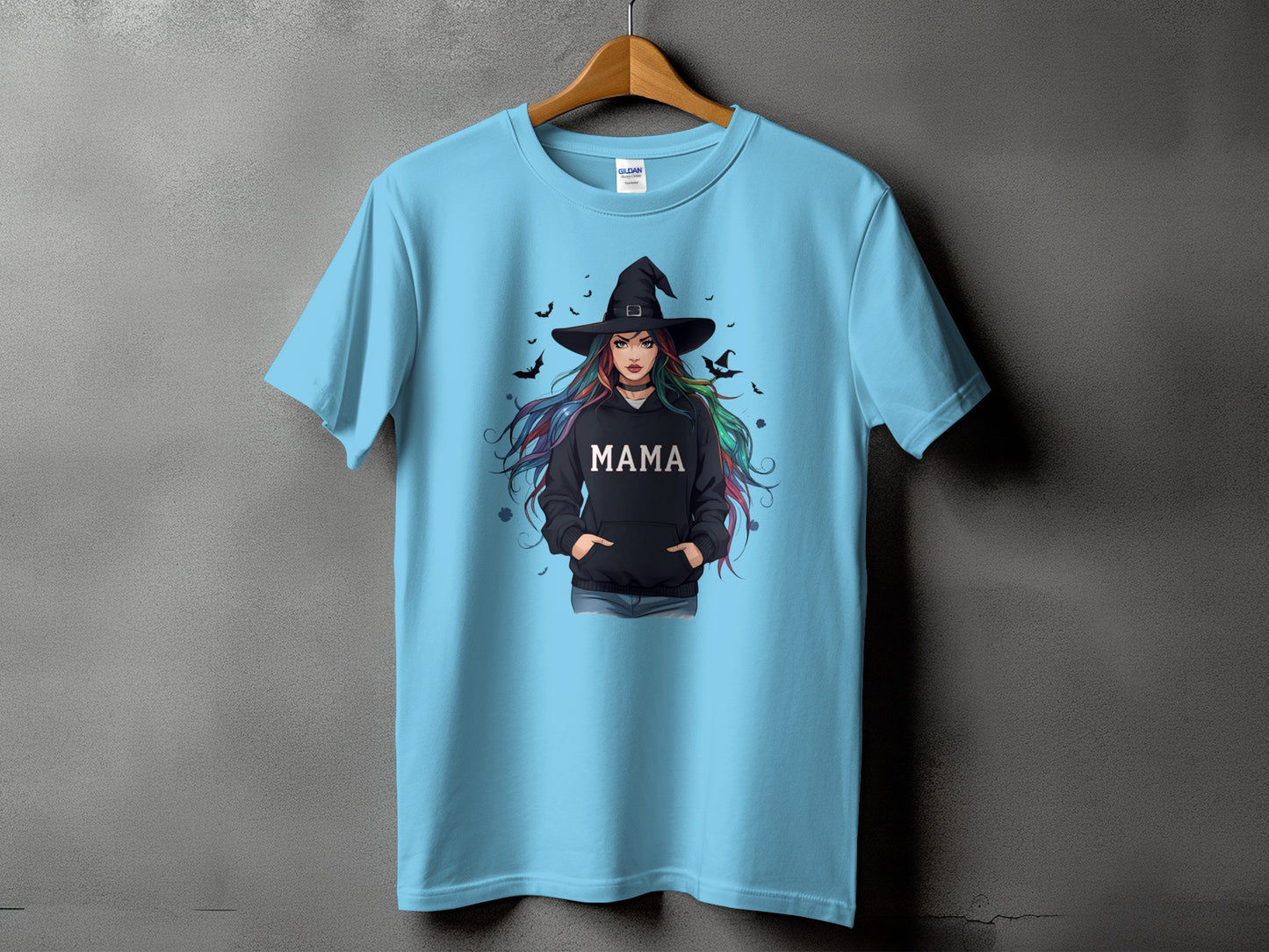 Light blue t-shirt with a witch graphic and "MAMA" text.