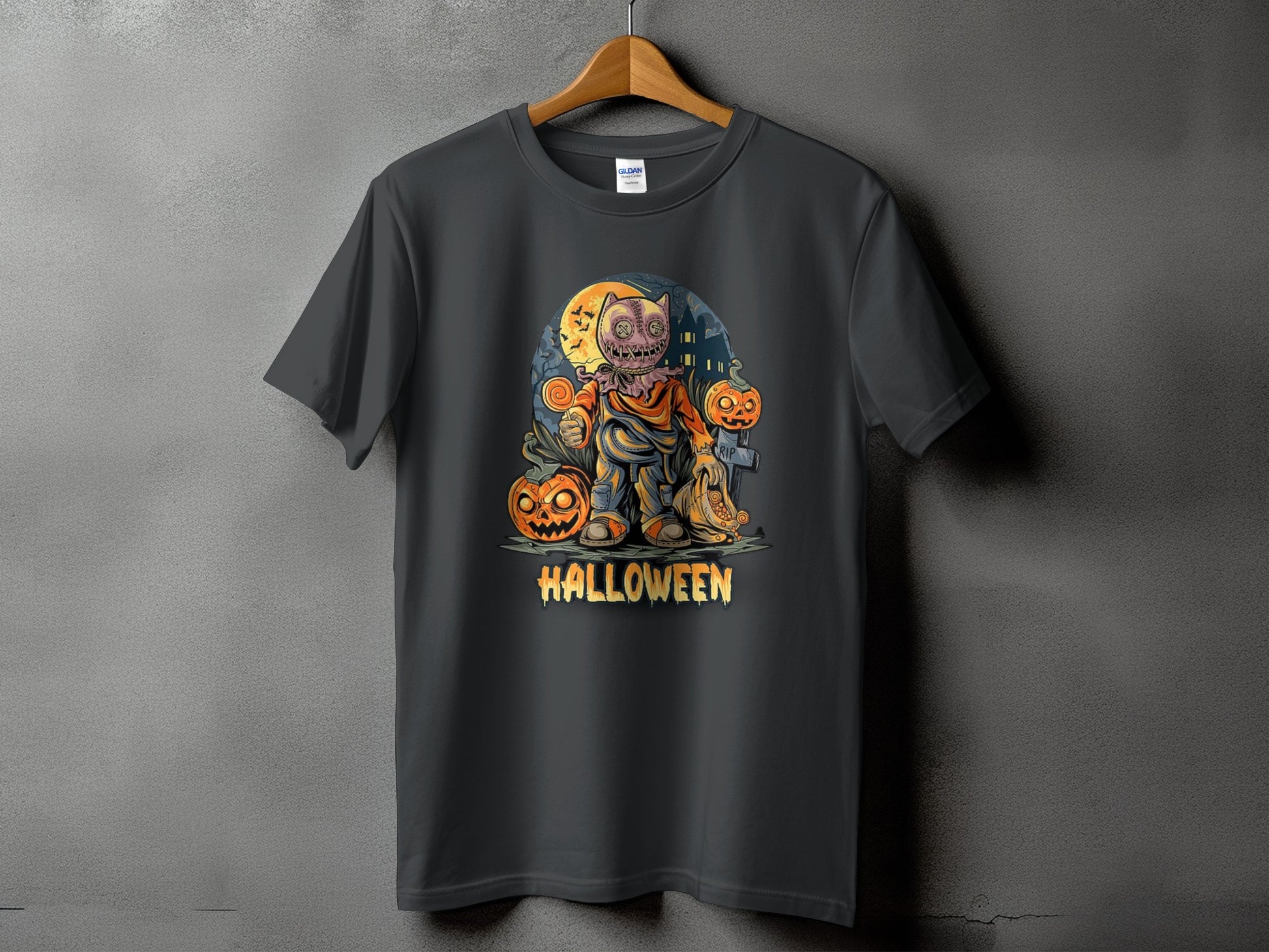 Dark t-shirt with a Halloween graphic featuring a scarecrow character and pumpkins.