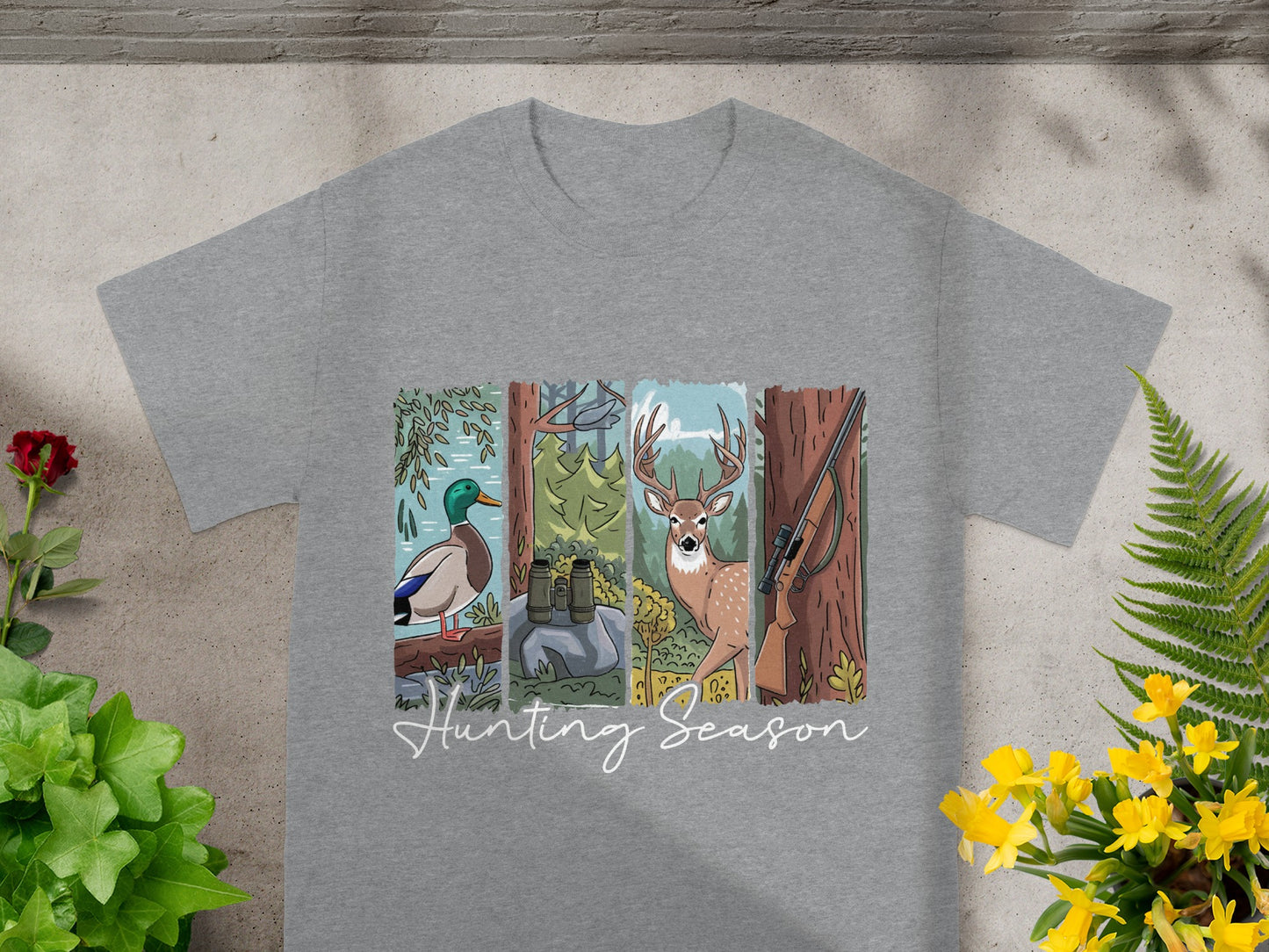 Gray t-shirt with artwork of duck, binoculars, deer, and rifle, with "Hunting Season" text.