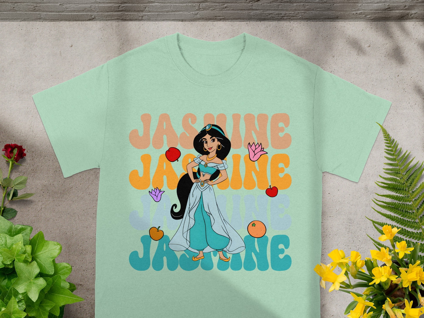 Disney's Jasmine on a mint green t-shirt with orange text.
