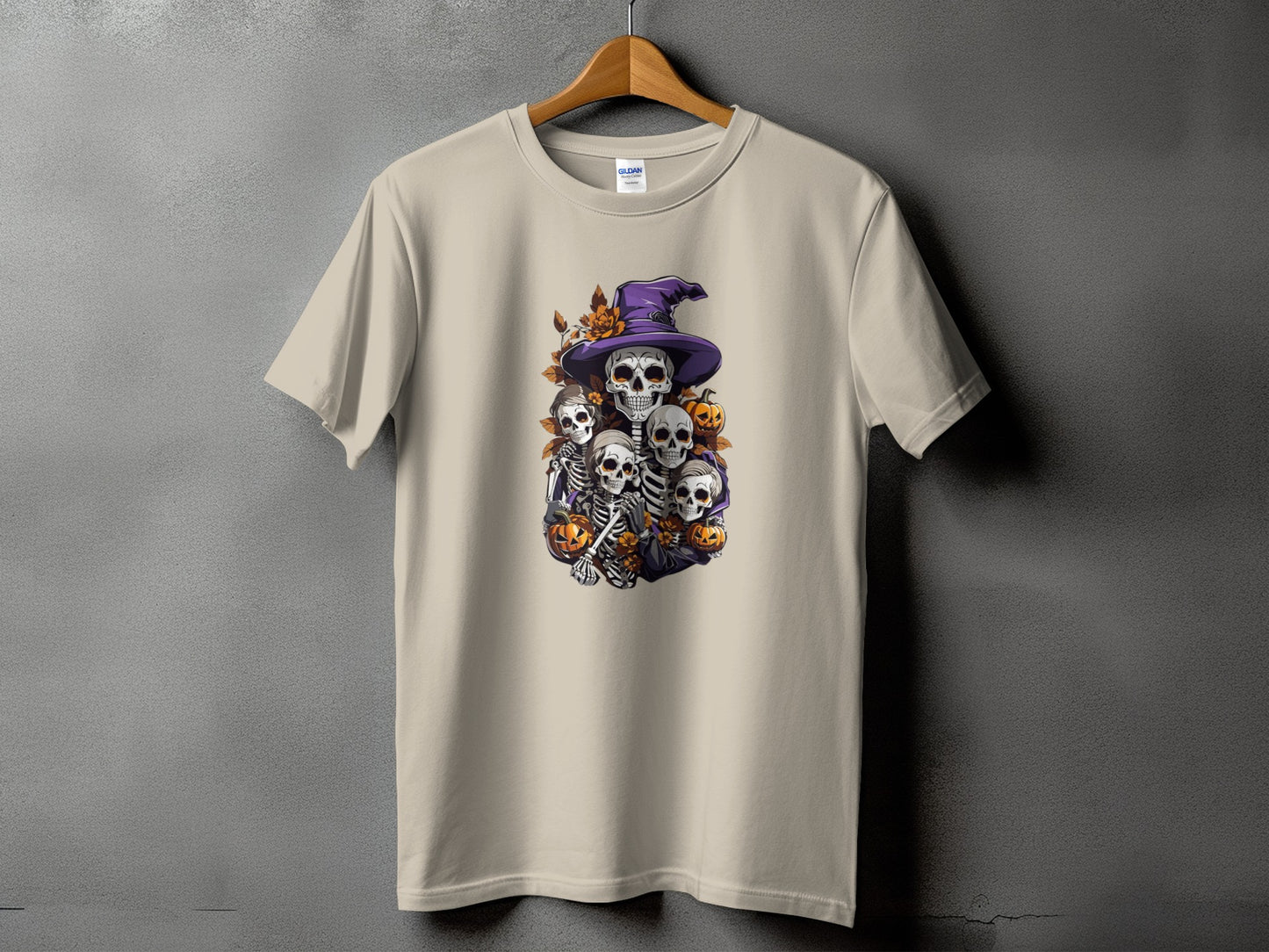 T-shirt with Halloween skeletons, pumpkins, and a witch hat graphic.