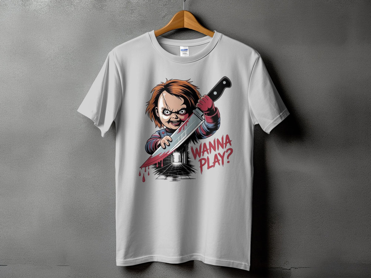 White t-shirt with Chucky doll holding a bloody knife, text "WANNA PLAY?".