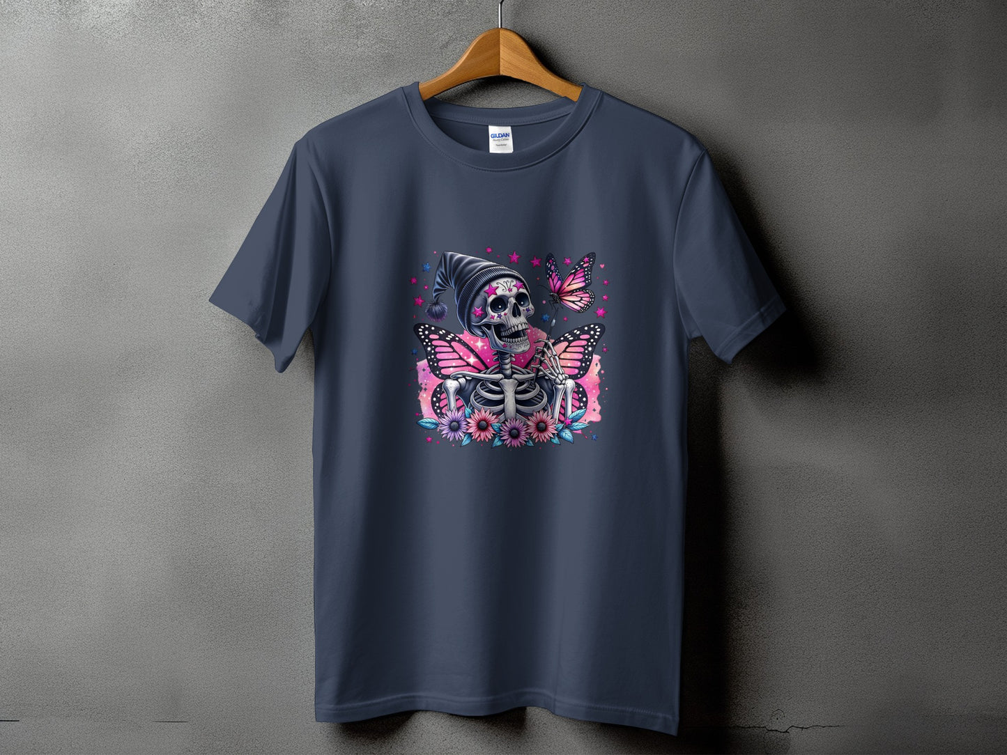 Dark blue t-shirt with a skeleton wearing a hat, butterflies, and flowers graphic.