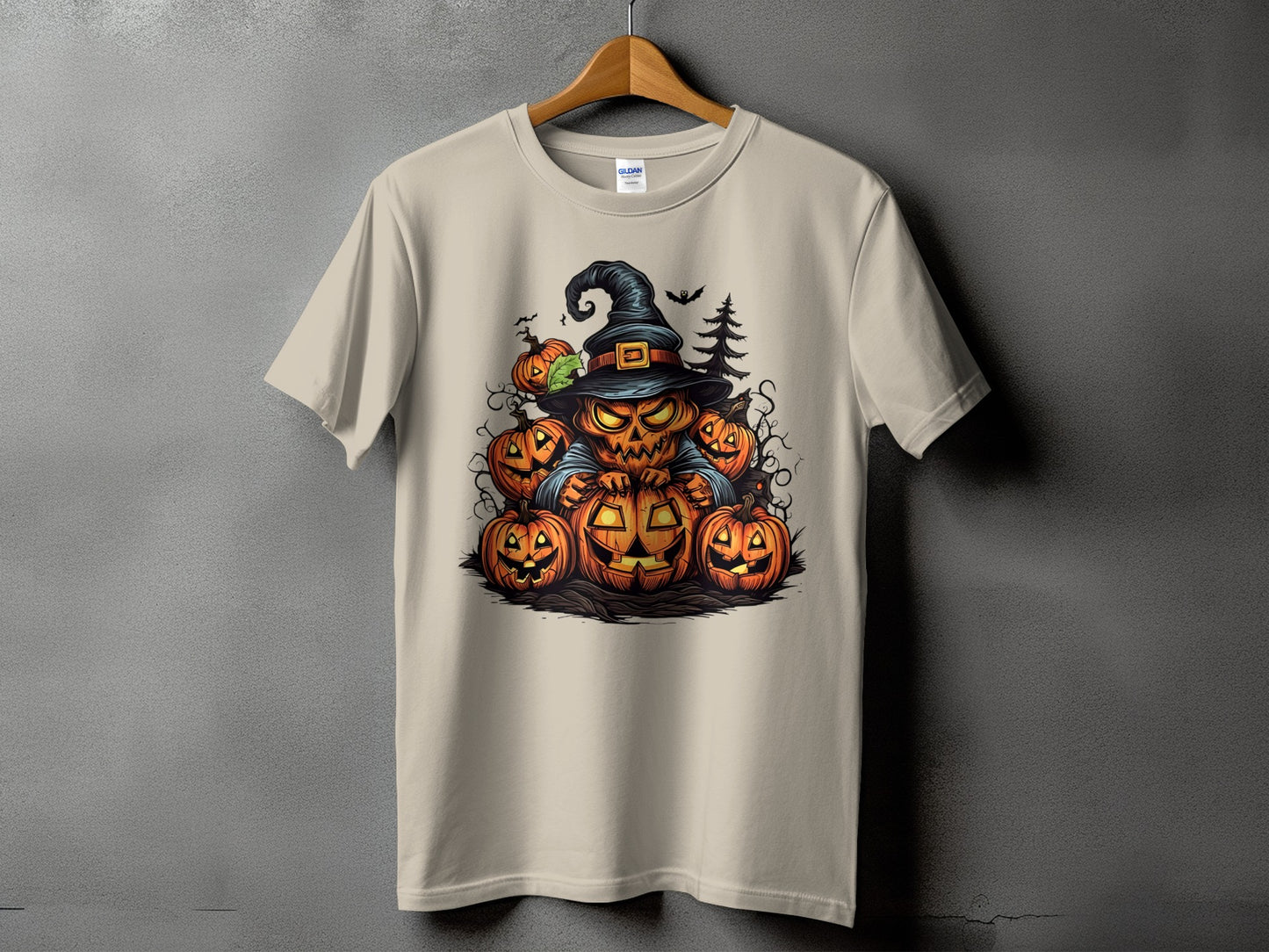 T-shirt with a Halloween pumpkin character wearing a witch hat and surrounded by pumpkins.