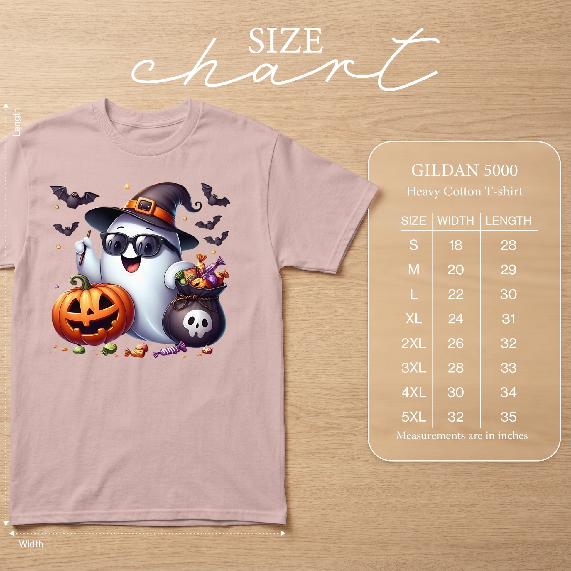 Pink t-shirt with a ghost, pumpkin, candy, and bats graphic, includes size chart.