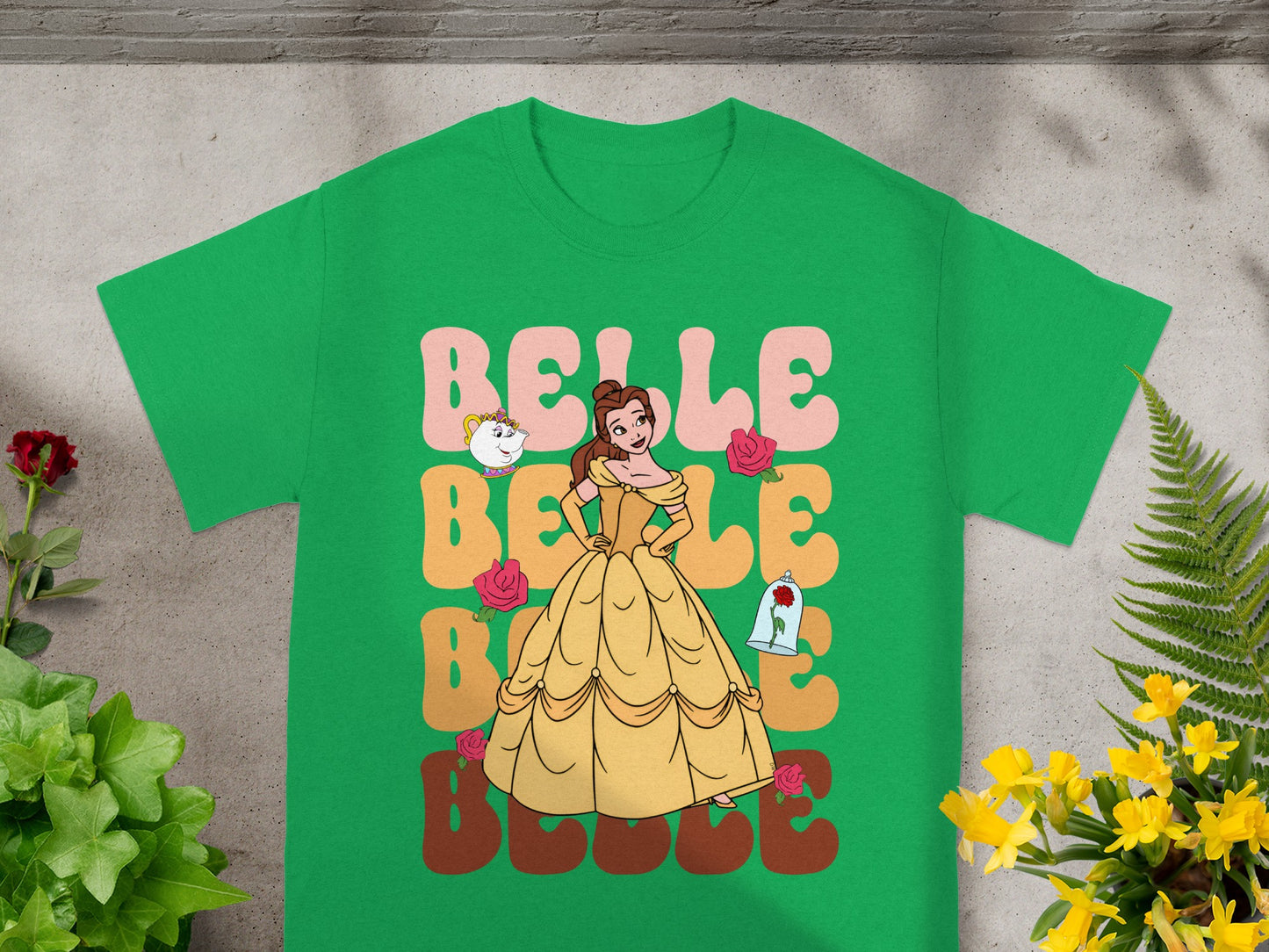 Belle in yellow dress with "Belle" text and roses on a green t-shirt.