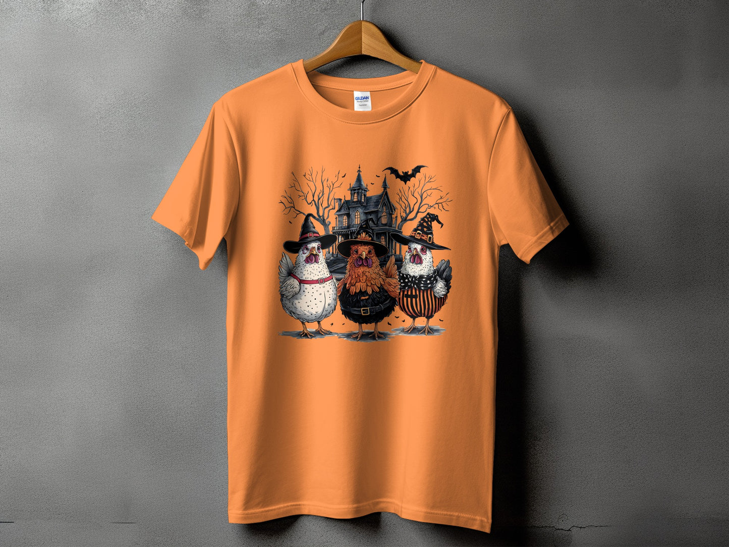 Three chickens in Halloween costumes stand before a spooky house.