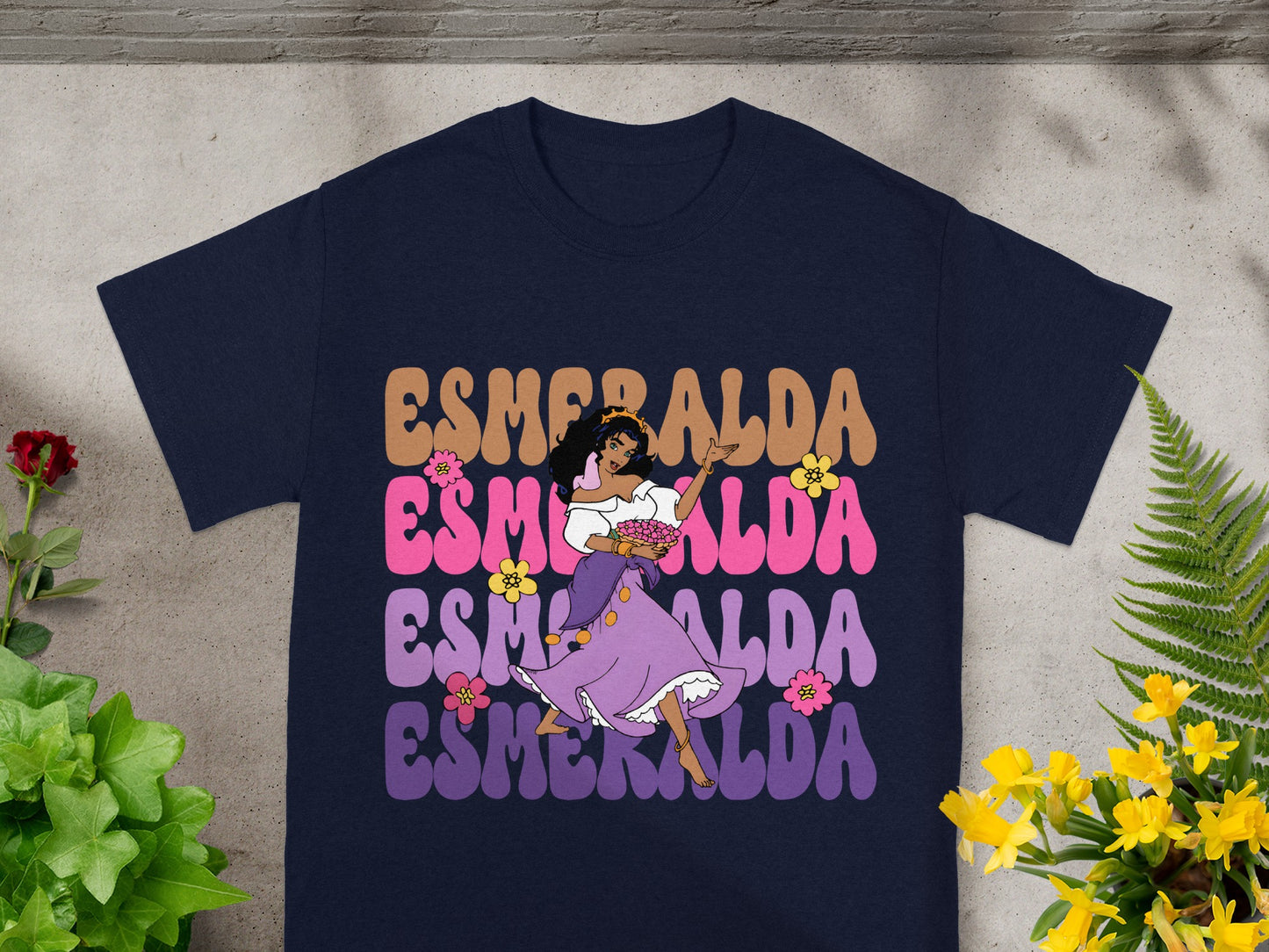 T-shirt with Esmeralda illustration and text in colorful retro font.
