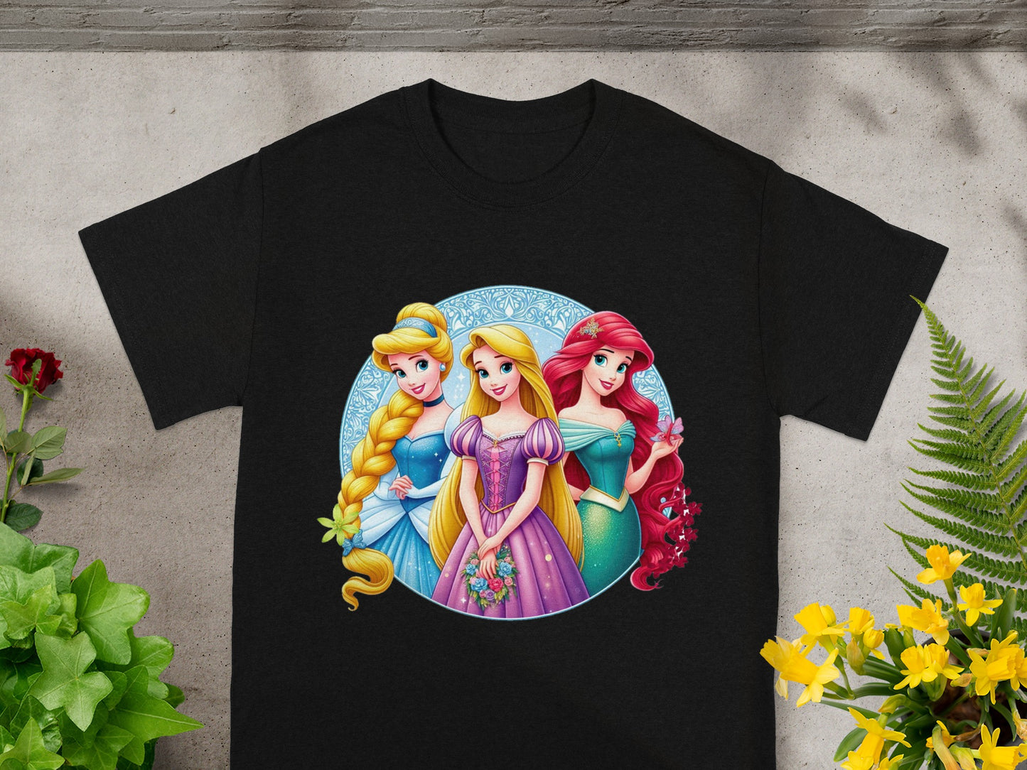Black t-shirt with Disney princesses Cinderella, Ariel, and Aurora.